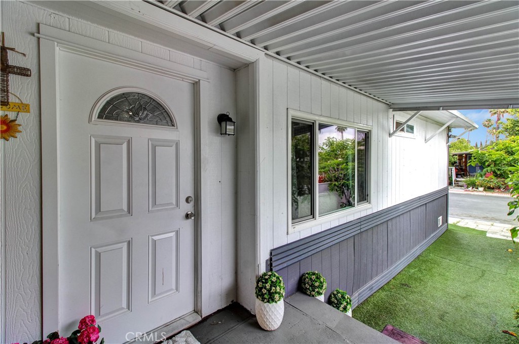 1025 South Riverside Avenue, Unit 26 Rialto, CA 92376 - Photo 6 of 27 a view of entryway with garden