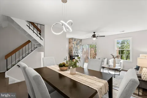 a view of a livingroom with furniture window and wooden floor
