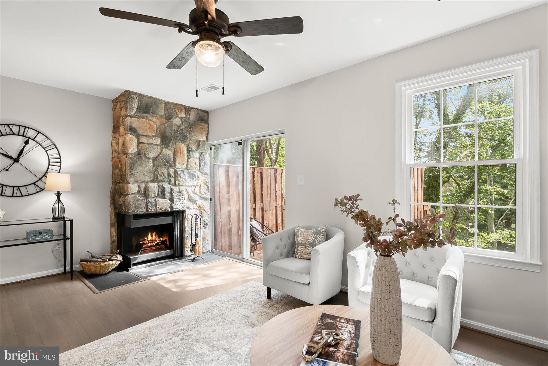 1530 Tanyard Hill Road Gaithersburg, MD 20879 - Photo 13 of 40 a living room with furniture a fireplace and a chandelier