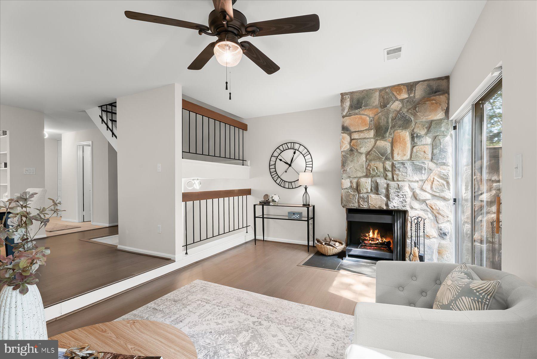 1530 Tanyard Hill Road Gaithersburg, MD 20879 - Photo 14 of 40 a living room with furniture a fireplace and a flat screen tv