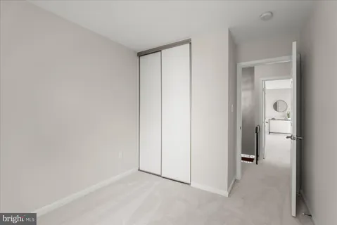 a bathroom with a bath tub sink and mirror