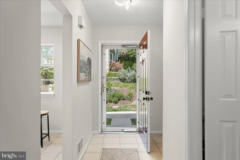 a view of a porch with a floor to ceiling window