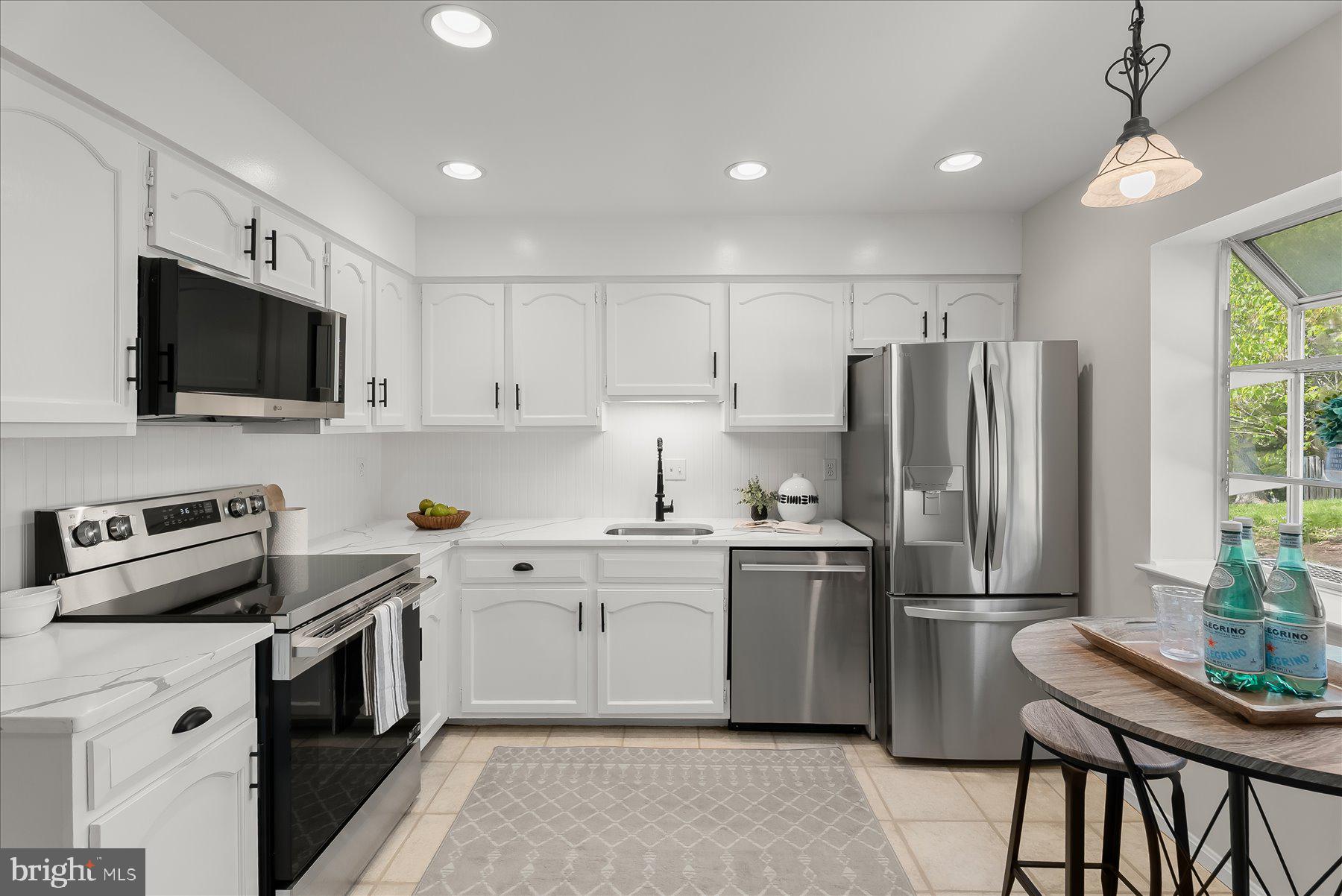 1530 Tanyard Hill Road Gaithersburg, MD 20879 - Photo 5 of 40 a kitchen with cabinets stainless steel appliances and a window