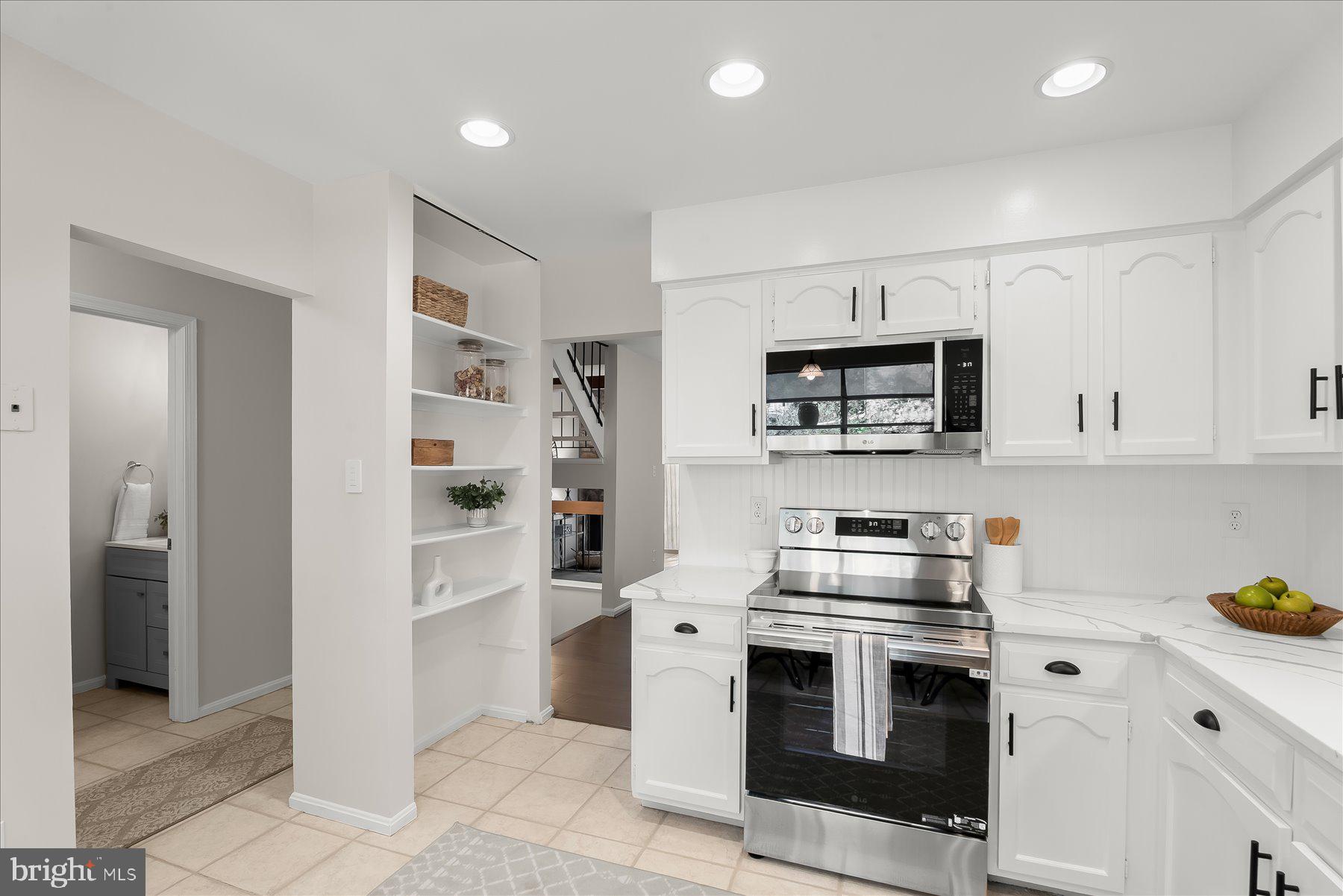 1530 Tanyard Hill Road Gaithersburg, MD 20879 - Photo 8 of 40 a kitchen with stainless steel appliances granite countertop a stove and a refrigerator