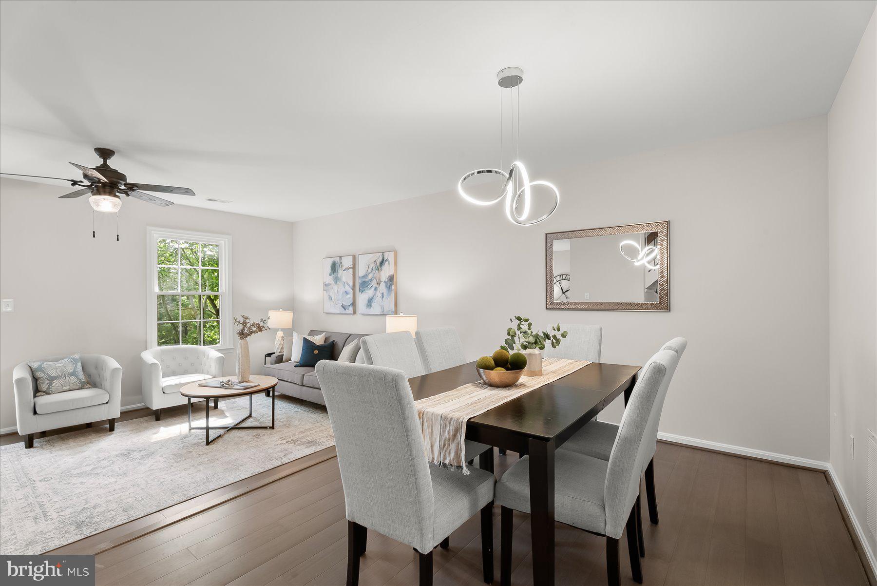 1530 Tanyard Hill Road Gaithersburg, MD 20879 - Photo 10 of 40 a view of a dining room with furniture and a chandelier