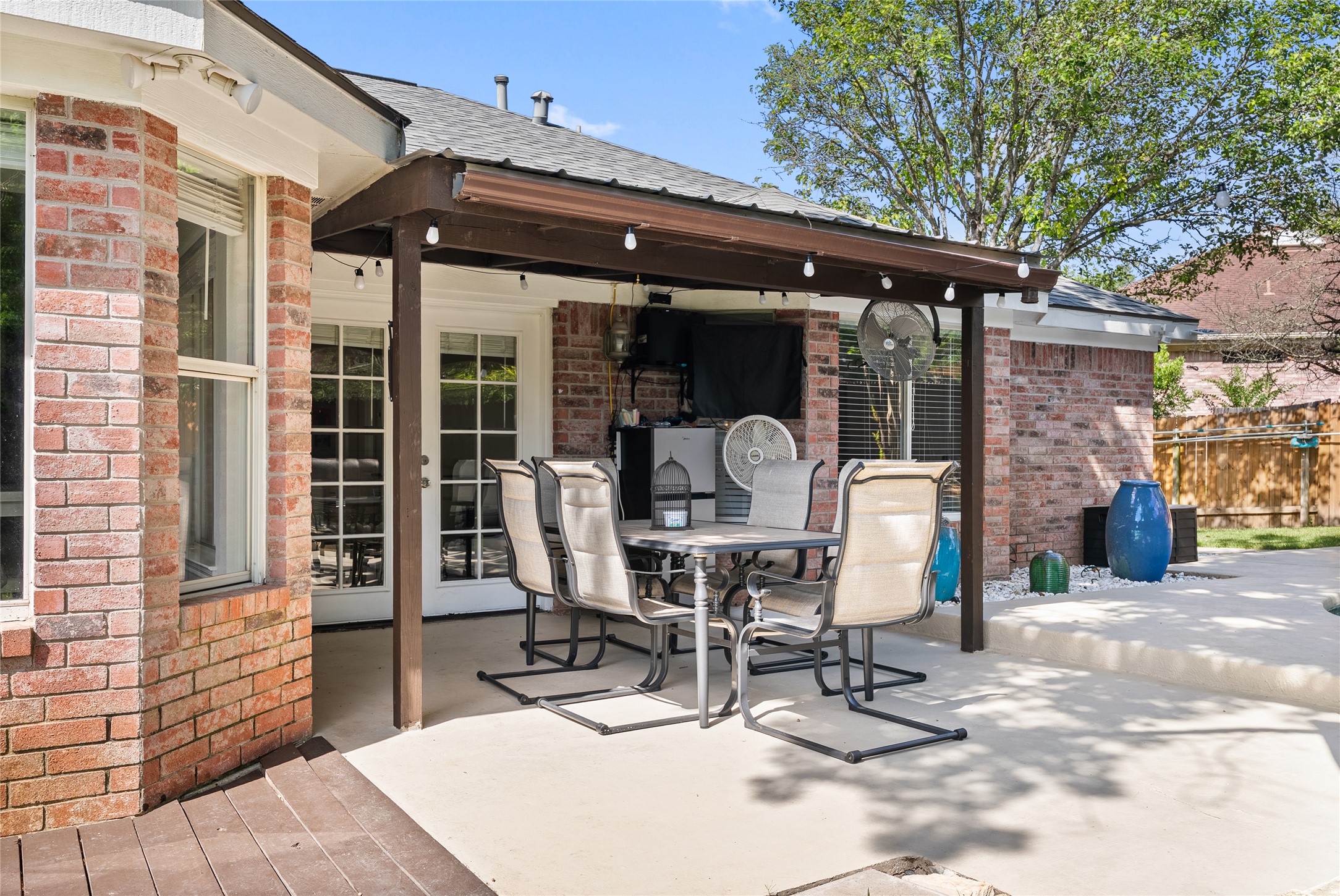 9024 Heiden Lane Austin, TX 78749 - Photo 29 of 33 This shaded covered patio acts as an ideal spot for hosting friends on warm evenings, offering a comfortable outdoor setup where weekend gatherings can naturally spill out onto the deck
