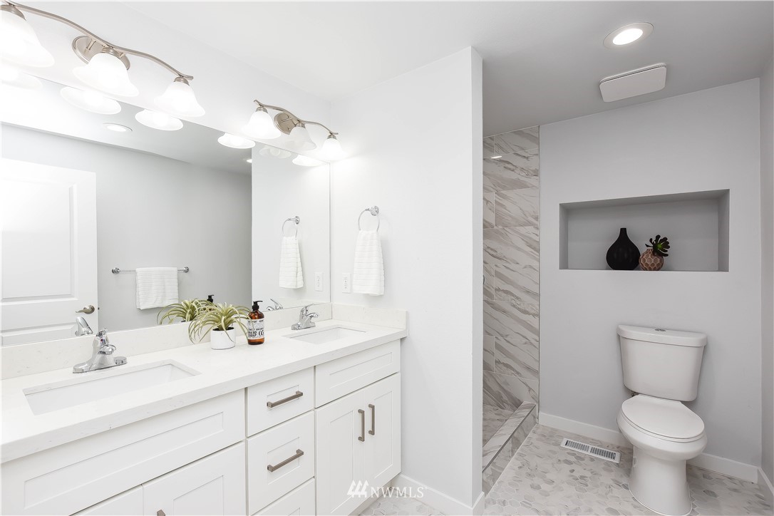 322 170th Place Southwest Bothell, WA 98012 - Photo 23 of 37 a bathroom with a toilet sink and mirror