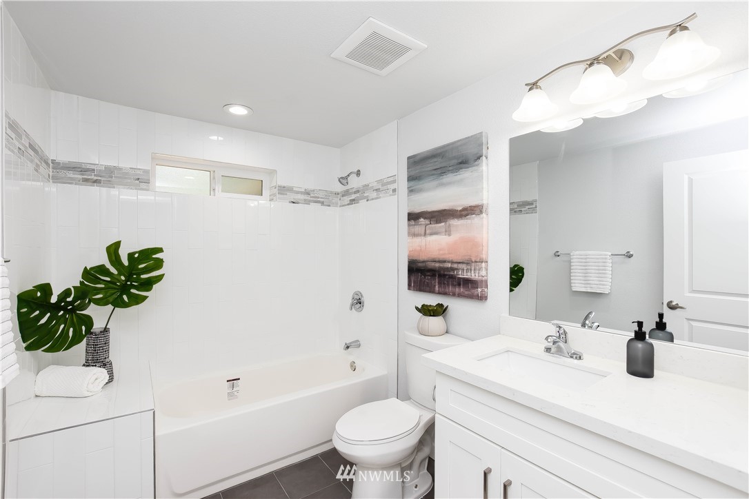 322 170th Place Southwest Bothell, WA 98012 - Photo 26 of 37 a bathroom with a sink a toilet and a mirror