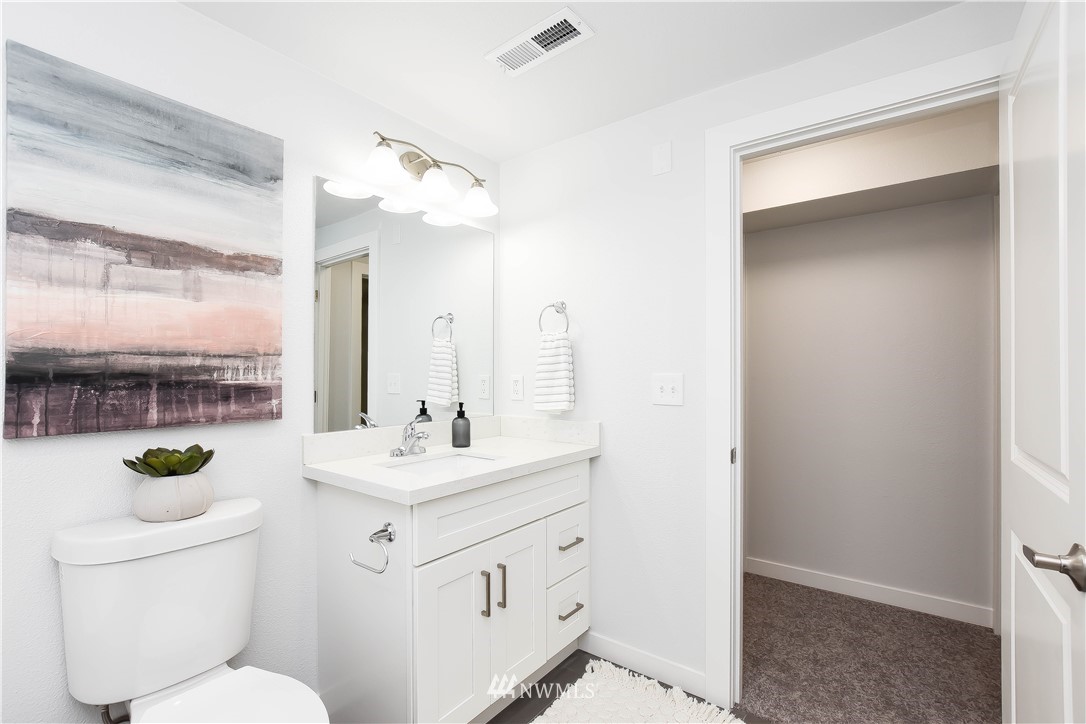322 170th Place Southwest Bothell, WA 98012 - Photo 27 of 37 a bathroom with a sink a toilet and mirror