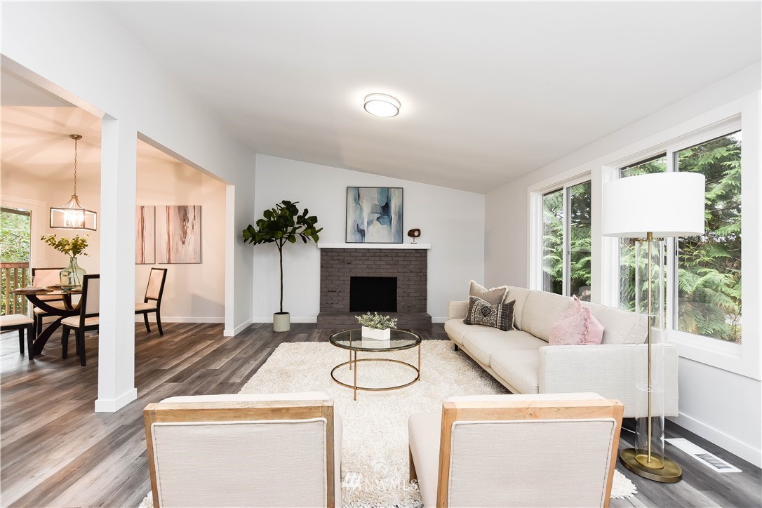 322 170th Place Southwest Bothell, WA 98012 - Photo 6 of 37 a living room with furniture a fireplace and a table