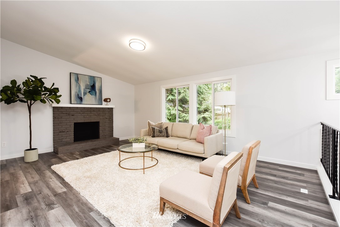 322 170th Place Southwest Bothell, WA 98012 - Photo 8 of 37 a living room with furniture a window and a fireplace