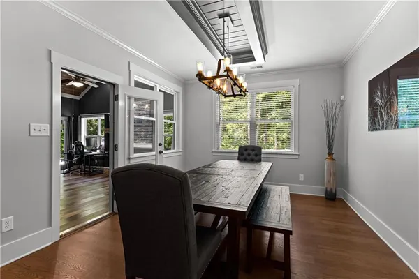 a kitchen with granite countertop stainless steel appliances a refrigerator stove top oven and sink