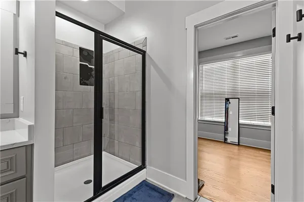 a bathroom with a sink vanity and a mirror