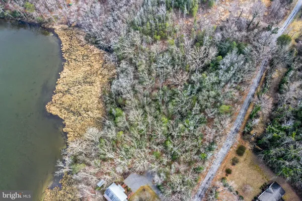an aerial view of house with mountain view