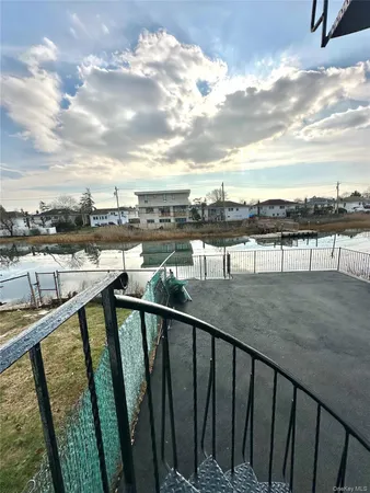 a view of swimming pool from a balcony