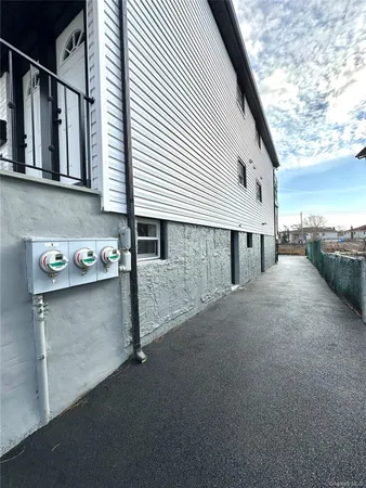 a view of a house with a street