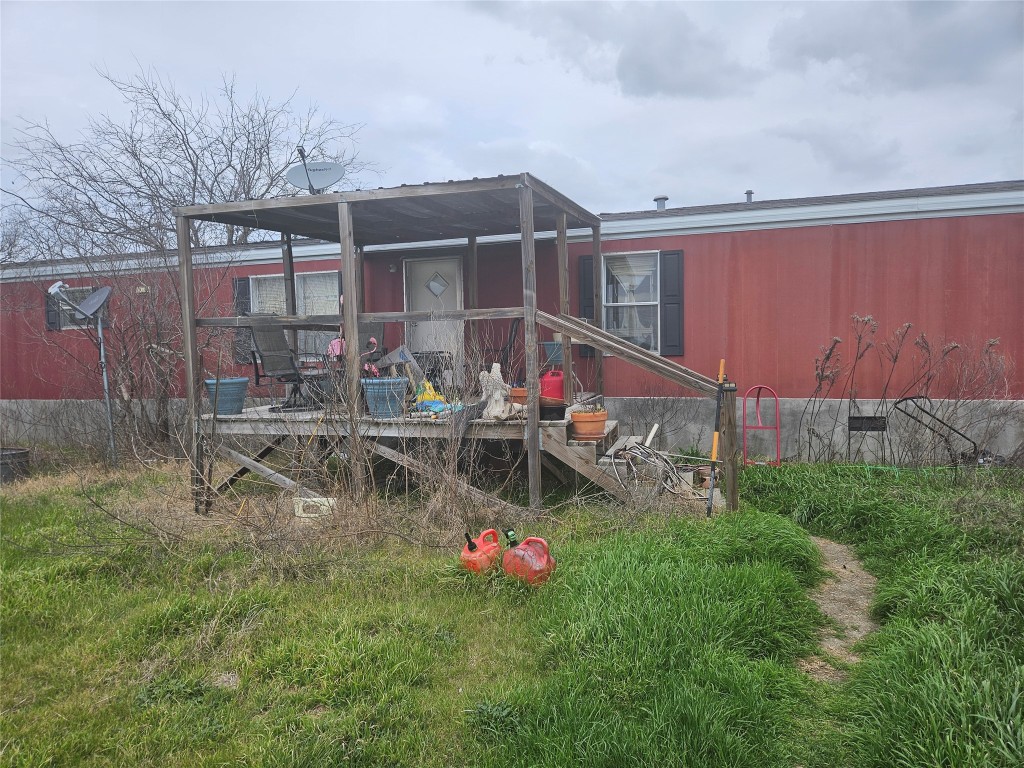 20948 Cameron Road Coupland, TX 78615 - Photo 1 of 1 a backyard of a house with table and chairs