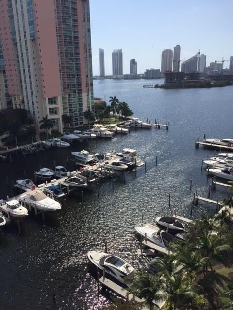 3340 Northeast 190th Street, Unit 1105 Miami, FL 33180 - Photo 12 of 17 a view of swimming pool with outdoor seating and city view