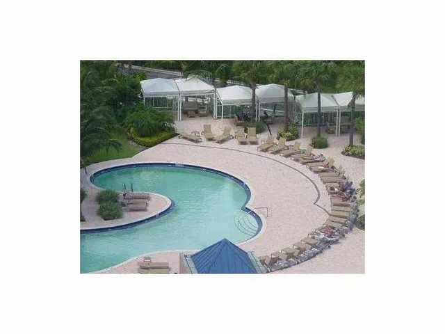 a view of living room with furniture and floor to ceiling window