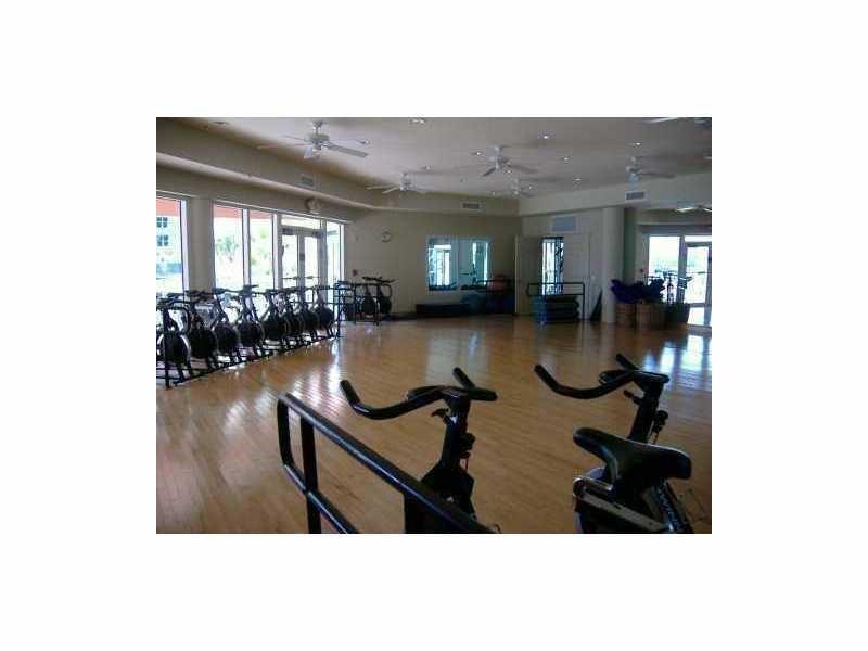 3340 Northeast 190th Street, Unit 1105 Miami, FL 33180 - Photo 4 of 17 a view of living room with furniture and floor to ceiling window
