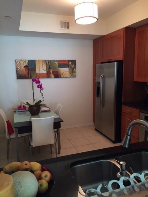 3340 Northeast 190th Street, Unit 1105 Miami, FL 33180 - Photo 9 of 17 a room with storage and utility