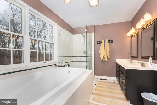 a view of a kitchen with sink and cabinets