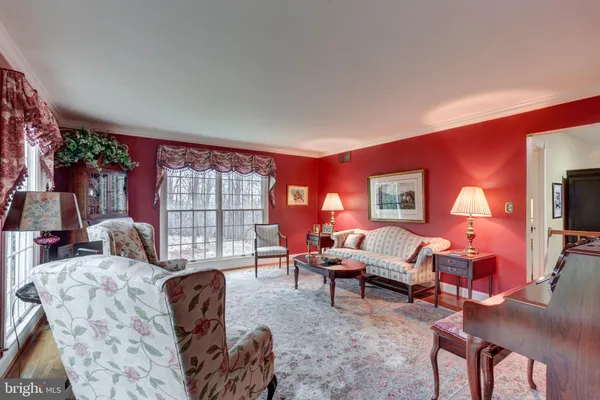 a view of a dining room with furniture and window