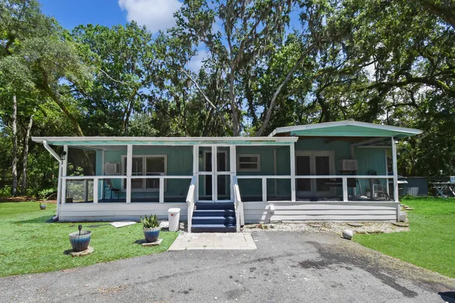 a house with trees in the background