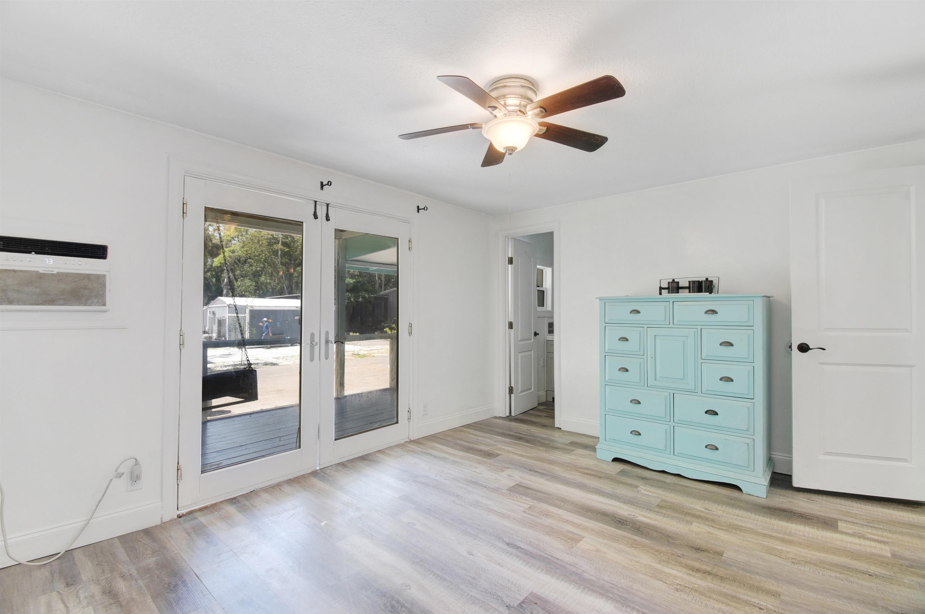 4895 Ave D St. Augustine, FL 32095 - Photo 13 of 25 a view of a livingroom with wooden floor closet and windows