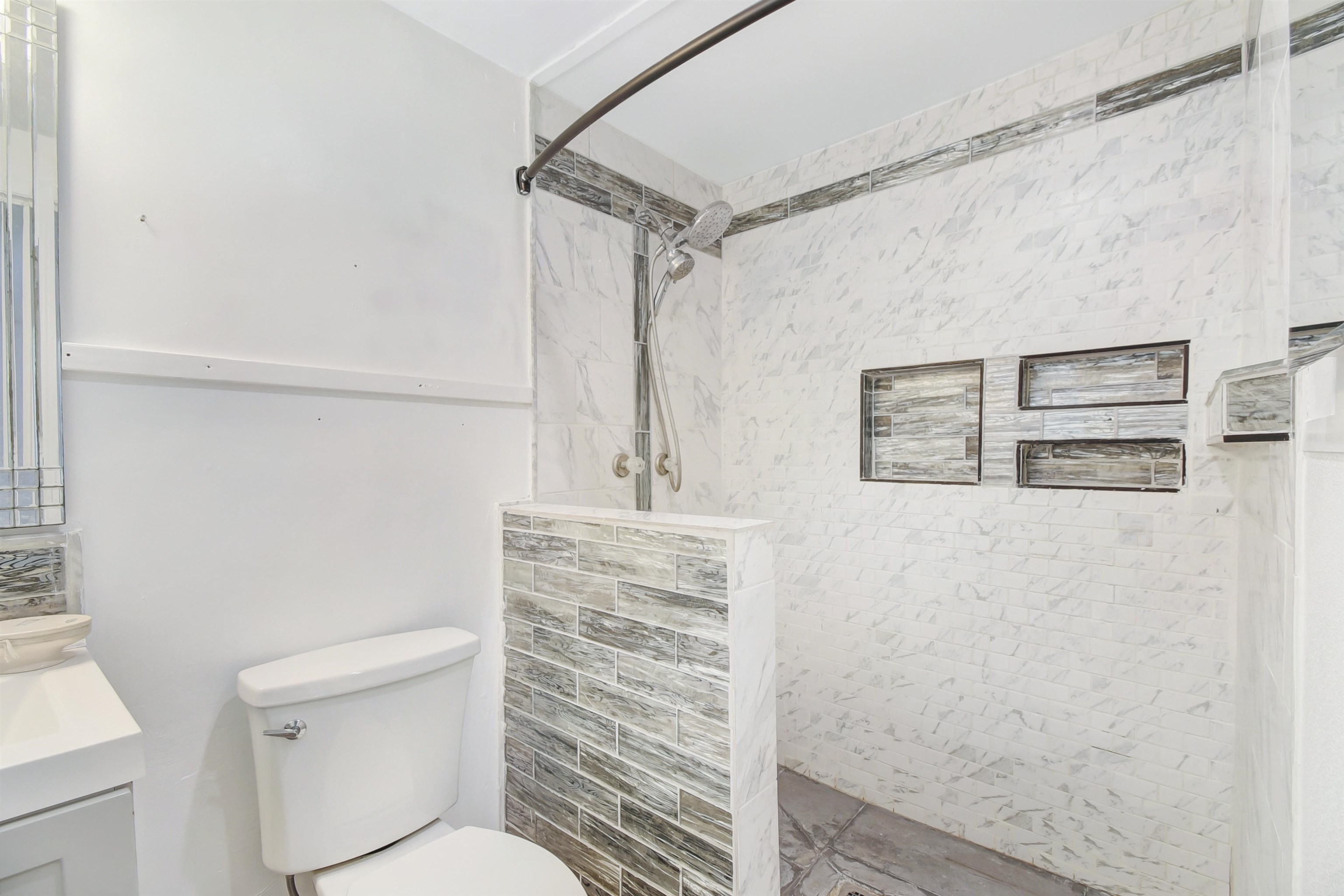 4895 Ave D St. Augustine, FL 32095 - Photo 21 of 25 a bathroom with a toilet and a shower