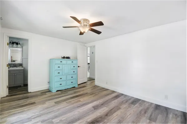 a view of a dresser with wooden floor