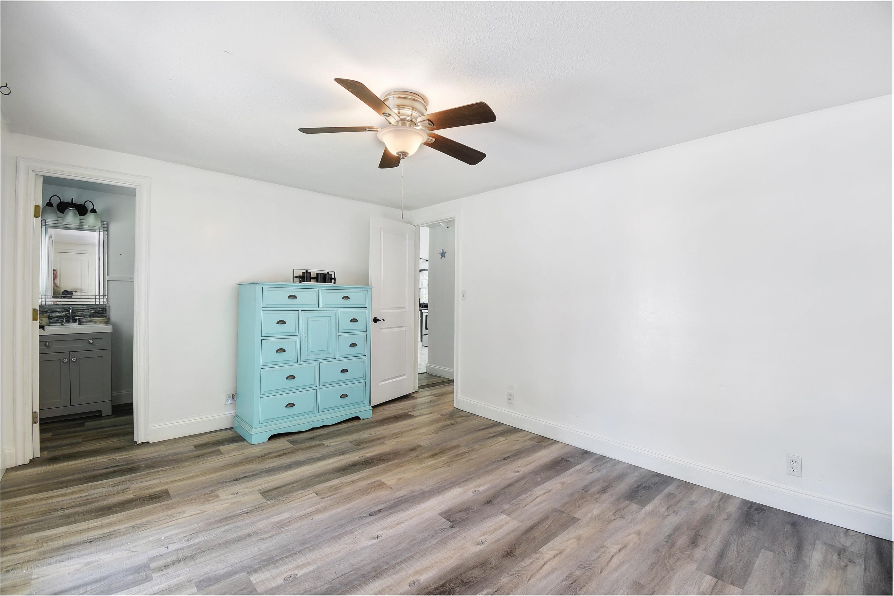 4895 Ave D St. Augustine, FL 32095 - Photo 24 of 25 a view of a dresser with wooden floor