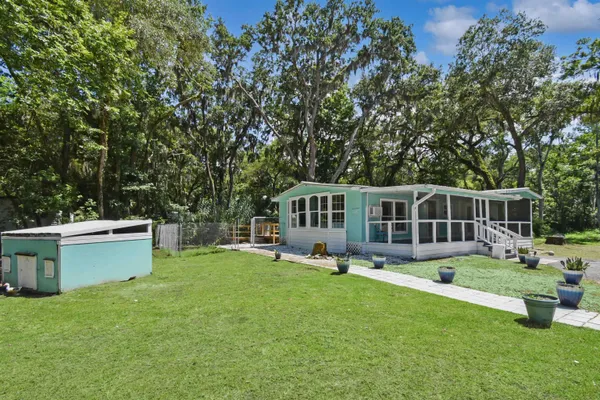 a front view of house with yard and entertaining space