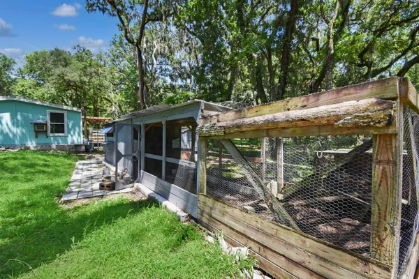 a view of a couches in backyard of house