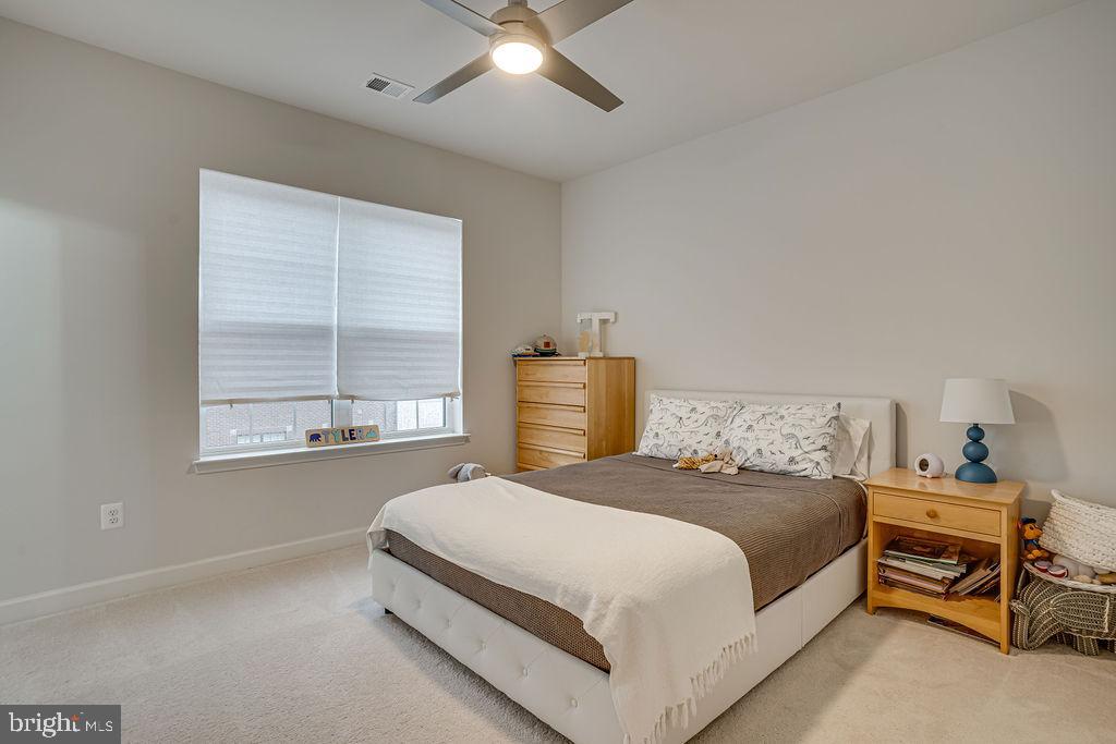 518 Triggerfish Drive Oxon Hill, MD 20745 - Photo 22 of 35 a bedroom with a bed and window
