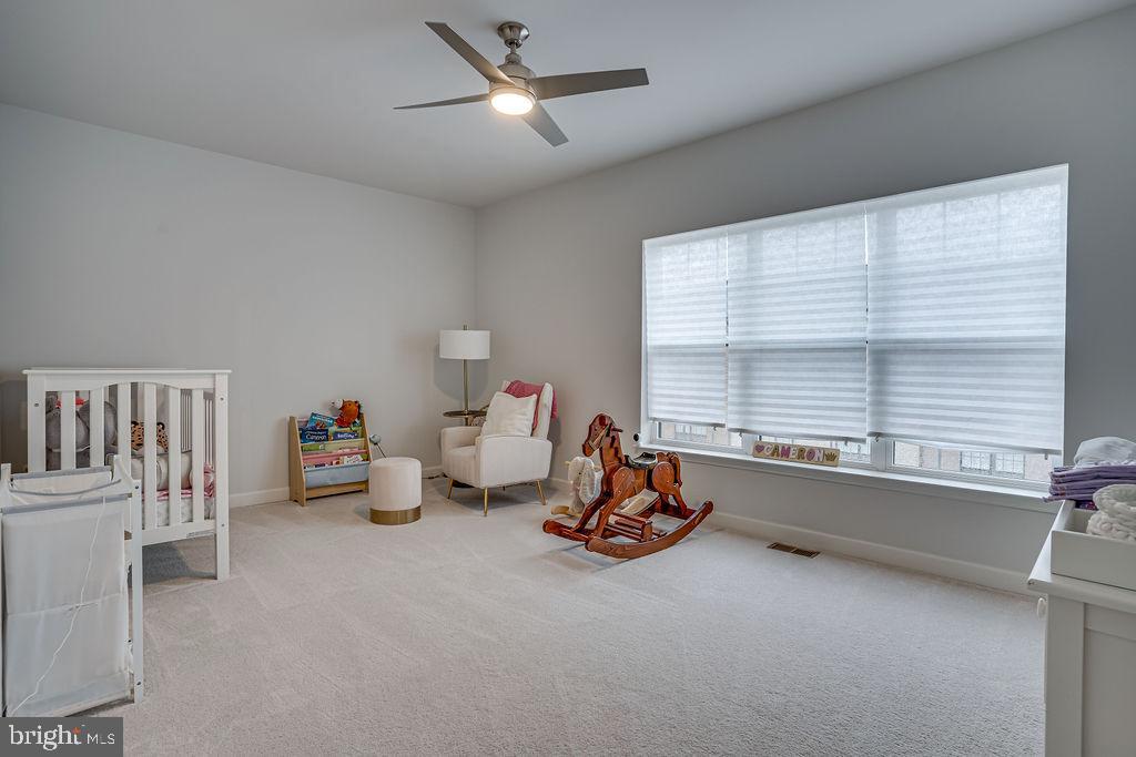 518 Triggerfish Drive Oxon Hill, MD 20745 - Photo 27 of 35 a very nice looking room with a large window and a chandelier