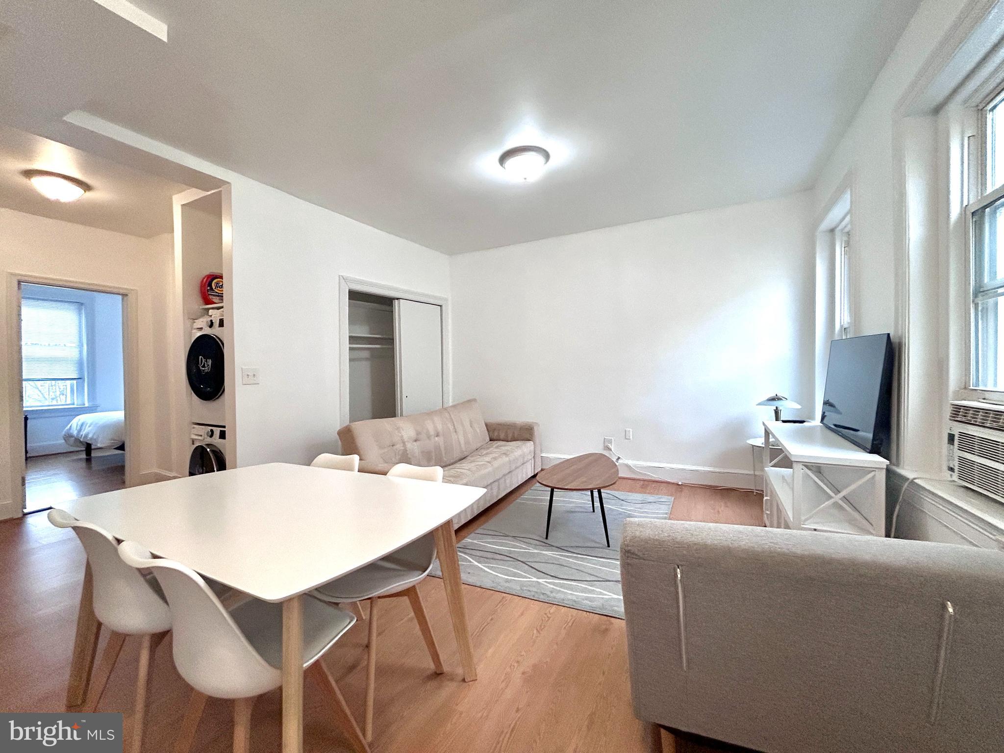 1544 Independence Avenue Southeast, Unit 3 Washington, DC 20003 - Photo 2 of 10 a view of a dining room with furniture and wooden floor