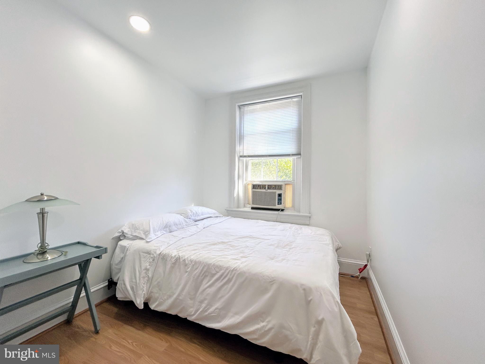 1544 Independence Avenue Southeast, Unit 3 Washington, DC 20003 - Photo 6 of 10 a bedroom with a bed and a window