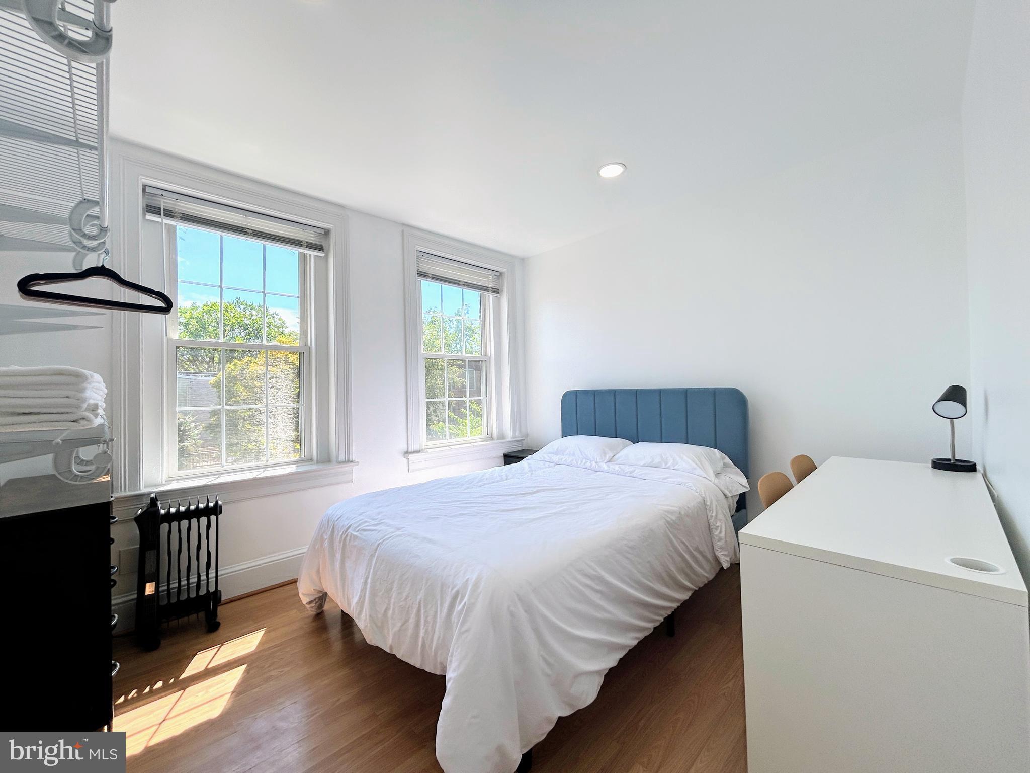 1544 Independence Avenue Southeast, Unit 3 Washington, DC 20003 - Photo 8 of 10 a bedroom with a bed and a window
