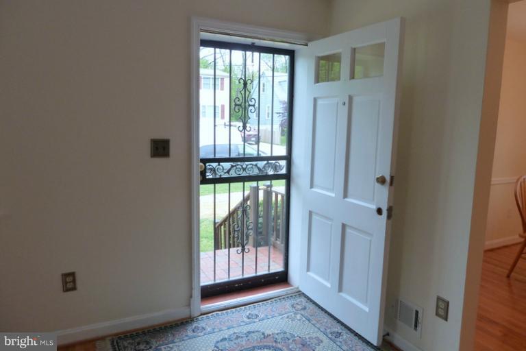 1603 Moffet Road Silver Spring, MD 20903 - Photo 1 of 30 a view of a hallway with windows