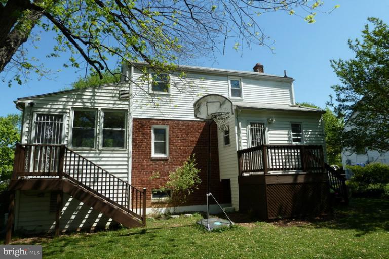 1603 Moffet Road Silver Spring, MD 20903 - Photo 18 of 30 a front view of a house with a yard