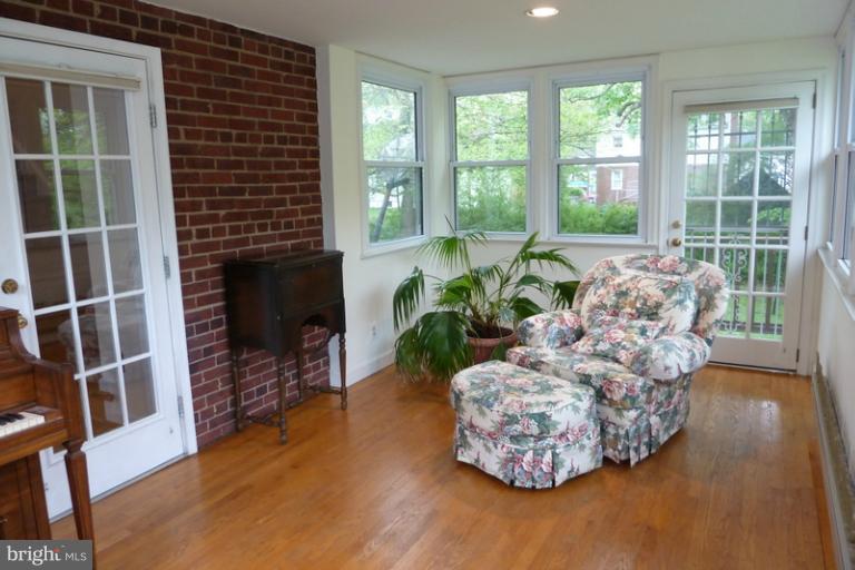 1603 Moffet Road Silver Spring, MD 20903 - Photo 20 of 30 a living room with furniture wooden floor and a fireplace
