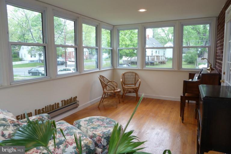 1603 Moffet Road Silver Spring, MD 20903 - Photo 26 of 30 a balcony with table and chairs and a barbeque