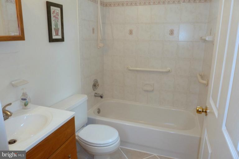 1603 Moffet Road Silver Spring, MD 20903 - Photo 27 of 30 a bathroom with a sink toilet and bathtub