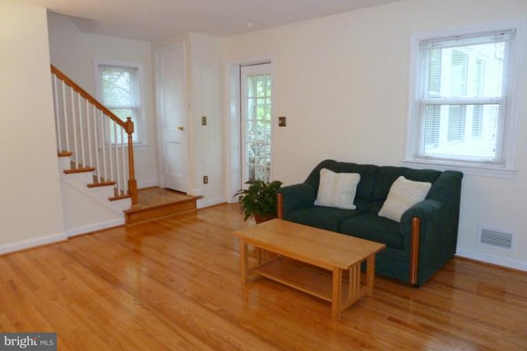 1603 Moffet Road Silver Spring, MD 20903 - Photo 9 of 30 a living room with furniture and wooden floor