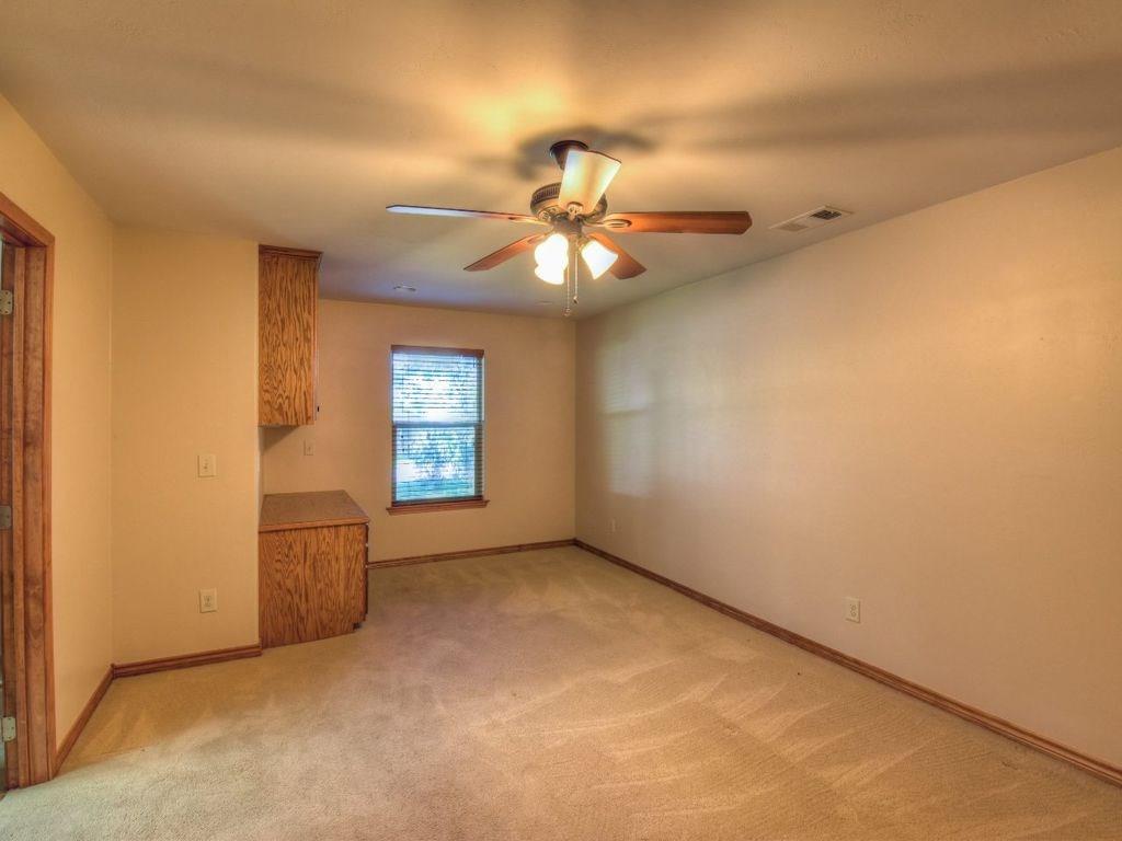 420 7th Street Marble Falls, TX 78654 - Photo 6 of 15 Unfurnished living room with light colored carpet and a ceiling fan