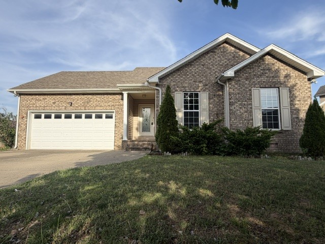 515 Preakness Circle Pleasant View, TN 37146 - Photo 13 of 13 a front view of a house with a yard and garage