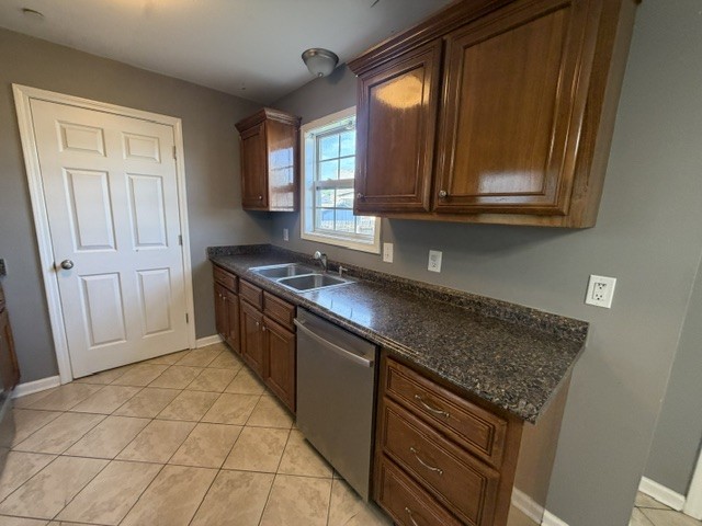 515 Preakness Circle Pleasant View, TN 37146 - Photo 5 of 13 a kitchen with stainless steel appliances granite countertop a stove a sink and a microwave