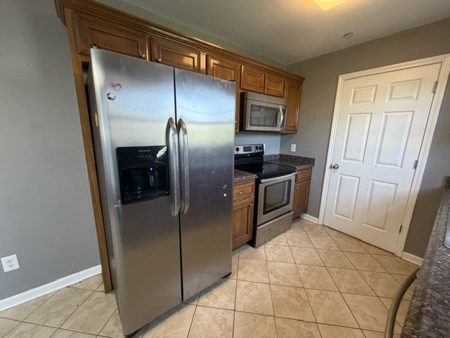 515 Preakness Circle Pleasant View, TN 37146 - Photo 6 of 13 a kitchen with granite countertop a refrigerator and a sink