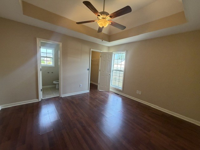 515 Preakness Circle Pleasant View, TN 37146 - Photo 7 of 13 an empty room with wooden floor and a ceiling fan